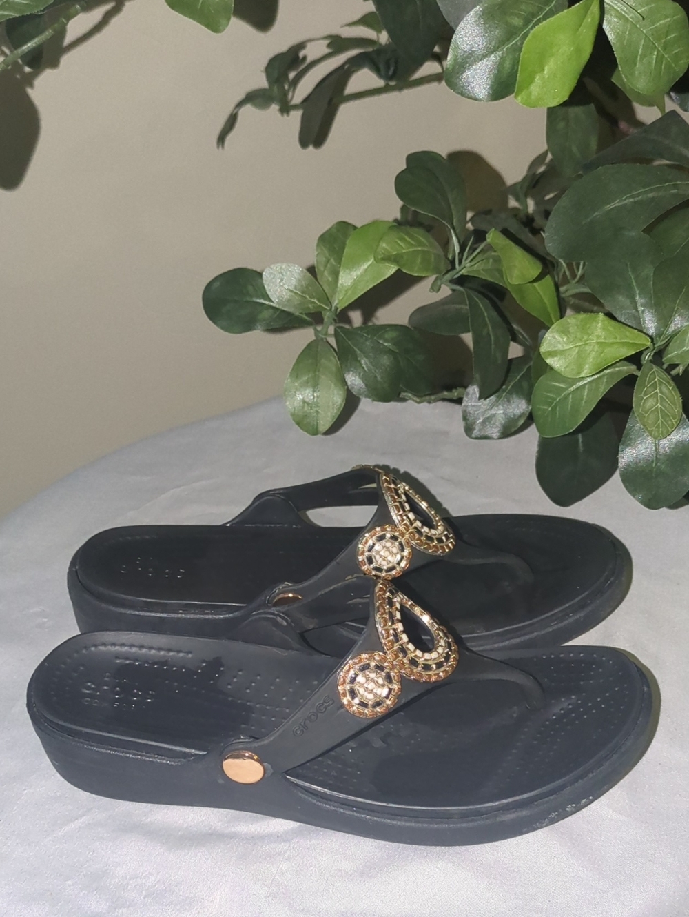 Crocs "Sanrah" Black Thong Sandals with Gold Ring Accent